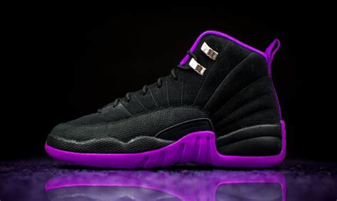 Facts. Made for big kids, the Air Jordan 12 Retro GS ‘Field Purple’ is crafted from black tumbled leather, accented with radiating stitched lines and fortified with a lizard-textured mudguard in a bold violet hue. An embroidered purple Jumpman decorates the tongue, while molded upper eyelets shine in a metallic gold finish. 